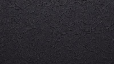 The primary subject of the image is a black background with a pattern of swirls and waves. The setting is a dark room, and the visual style is a close-up of the pattern. The colors and mood of the image are predominantly dark and moody, with the swirls and waves creating a sense of depth and intricacy.
