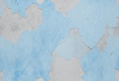 The primary subject of the image is a blue and white wall with a pattern of white and blue dots. The setting is a room with a blue and white tiled wall. The visual style is a combination of digital art and illustration. The dominant colors are blue and white, creating a calm and soothing atmosphere.