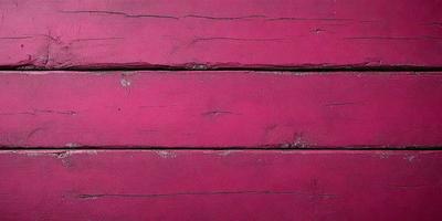 The primary subject of the image is a red wooden wall. The setting is a room with a red wall, and the visual style is a close-up of the wall. The dominant colors are red and pink, creating a warm and vibrant atmosphere.