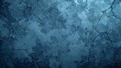 The primary subject of the image is a blue, textured wall with a cracked and rough surface. The setting is a room with a blue background, and the visual style is a close-up of the wall. The dominant colors are blue and grey, creating a calm and serene atmosphere.