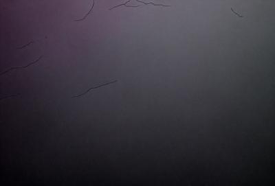 The primary subject of the image is a black background with a white line. The setting is a dark room, and the visual style is a simple, monochromatic design. The colors and mood are predominantly dark and moody, with the white line providing a contrasting element.
