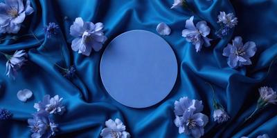 The primary subject of the image is a blue plate with a round shape. The plate is placed on a blue cloth, which serves as the setting or background. The visual style of the image is a photo, capturing the details of the blue plate and the blue cloth. The colors and mood of the image are predominantly blue, creating a calm and serene atmosphere.