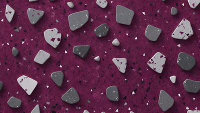 The primary subject of the image is a purple surface with a pattern of grey rocks. The setting appears to be a purple background, and the visual style is a close-up of the rocks. The dominant colors are purple and grey, creating a calm and serene atmosphere.