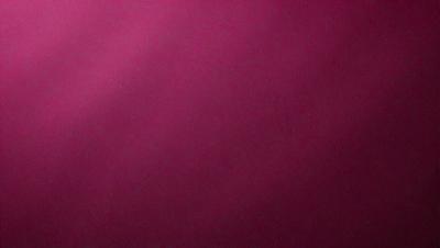 The primary subject of the image is a large, pink wall. The setting is a room with a pink background, and the visual style is a close-up of the wall. The colors and mood of the image are predominantly pink, creating a warm and inviting atmosphere.