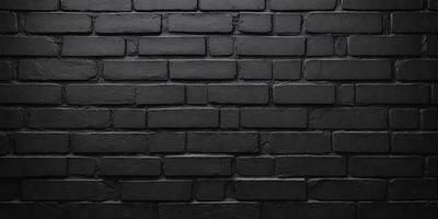 The primary subject of the image is a black brick wall. The setting is a brick wall, and the visual style is a photo. The dominant colors are black and grey, creating a moody atmosphere.