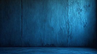 The primary subject of the image is a blue wall with a textured surface. The setting is a room with a concrete wall, and the visual style is a photo. The dominant colors are blue and gray, creating a calm and serene atmosphere.