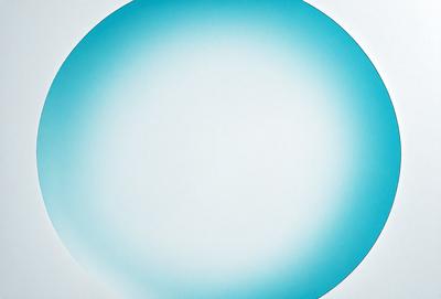 The primary subject of the image is a large, round, blue circle. The setting is a white background, which provides a clean and minimalist appearance. The visual style is a combination of a photo and a digital art, creating a unique and eye-catching design. The dominant colors are blue and white, giving the image a calm and soothing atmosphere.
