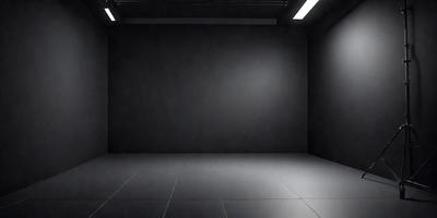 The primary subject of the image is a large, empty room with a black wall. The setting is a dark room with a black wall, and the visual style is a black and white photo. The colors and mood of the image are predominantly dark and moody, creating a sense of emptiness and solitude.