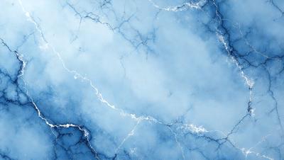 The primary subject of the image is a blue, cloudy sky with a few white clouds. The setting is a blue background, which creates a serene and calming atmosphere. The visual style is a photo, capturing the beauty of the sky and clouds. The colors and mood are predominantly blue, with a hint of white from the clouds, creating a sense of tranquility and peacefulness.