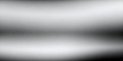 The image is a black and white photo of a white wall. The primary subject is the wall, which is the main object, scene, or focus of the image. The setting/background is a white wall, and the visual style is a black and white photo. The colors and mood are predominantly white, giving the image a simple and minimalist appearance.