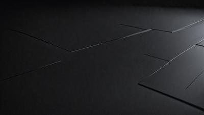 The primary subject of the image is a black surface with a pattern of triangles. The setting is a dark room, and the visual style appears to be a combination of a photo and a drawing. The dominant colors are black and grey, creating a moody atmosphere.
