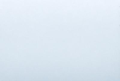 The primary subject of the image is a large, empty, and cloudy sky. The setting is a vast, open space with no visible landmarks or objects. The visual style is a natural, outdoor scene with a focus on the sky. The colors and mood of the image are predominantly gray and calm, with no vibrant colors or strong contrasts.