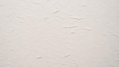The image features a white wall with a pattern of waves or ripples. The wall appears to be made of a material that resembles a canvas or a textured wallpaper. The pattern creates a visually interesting and unique appearance. The overall atmosphere of the image is clean and minimalistic, with the focus on the wall's design.