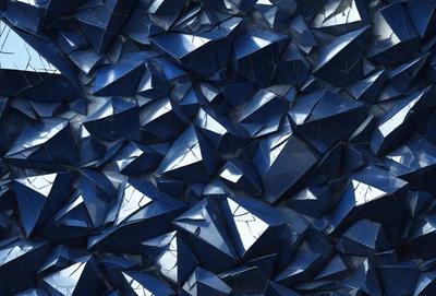 The primary subject of the image is a large blue crystal, which is the main object in the scene. The setting is a blue background, which creates a visually appealing contrast with the crystal. The visual style of the image is a close-up of the crystal, showcasing its intricate details. The dominant colors in the image are blue and silver, giving the scene a calm and serene atmosphere.