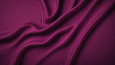 The primary subject of the image is a purple fabric, which is the main object, scene, or focus of the image. The setting or background is a purple cloth, and the visual style is a close-up of the purple fabric. The colors and mood of the image are predominantly purple, creating a calm and soothing atmosphere.
