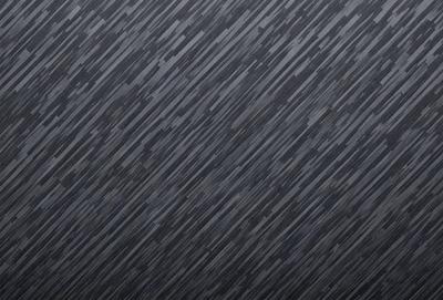 The primary subject of the image is a gray wall with a pattern of black and white squares. The setting is a room with a gray background, and the visual style appears to be a pattern or texture. The dominant colors are gray and black, creating a somewhat moody atmosphere.