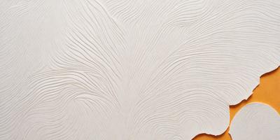 The image features a white wall with a pattern of swirls and curves. The wall appears to be made of marble, giving it a luxurious and elegant appearance. The swirls and curves create a visually interesting texture, making the wall stand out as a unique and eye-catching design element.