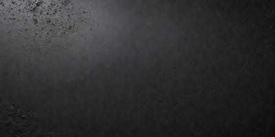 The primary subject of the image is a black background with a few specks of white. The setting is a dark room, and the visual style is a black and white photo. The colors and mood of the image are predominantly dark and moody, with the black background and white specks creating a dramatic and contrasting effect.