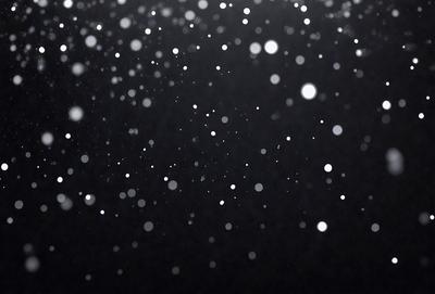 Primary subject: Snowflakes
Setting/background: Black background
Visual style: Digital art
Colors and mood: White snowflakes against a black background, creating a contrasting and visually appealing image.