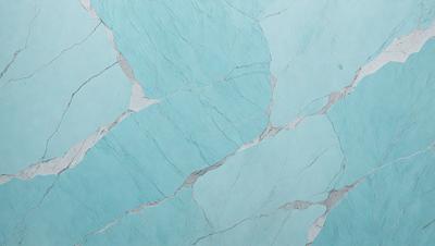 The primary subject of the image is a blue marble wall with a pattern of white and blue tiles. The setting is a bathroom, and the visual style is a photo. The dominant colors are blue and white, creating a calm and soothing atmosphere.