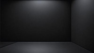 The primary subject of the image is a black wall with a white background. The setting is a room with a black wall, and the visual style is a black and white photo. The colors and mood of the image are predominantly dark, with a sense of emptiness or minimalism.