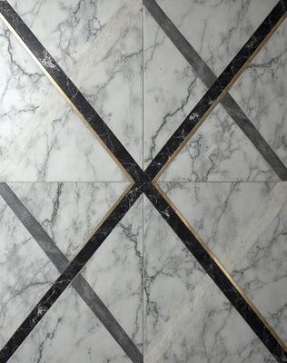 The primary subject of the image is a marble tile with a gold border. The setting is a bathroom, and the visual style is a photo. The dominant colors are white and gold, creating a luxurious and elegant atmosphere.