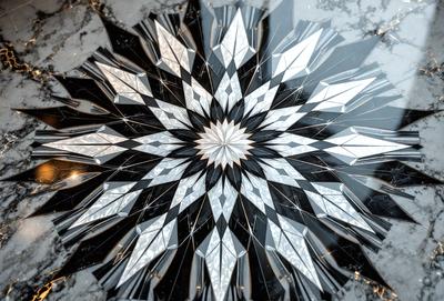 The primary subject of the image is a large, intricate, and colorful glass design. The setting is a marble table, and the visual style is a combination of photo and digital art. The colors and mood of the image are vibrant and lively, with a focus on the geometric patterns and shapes created by the glass design.