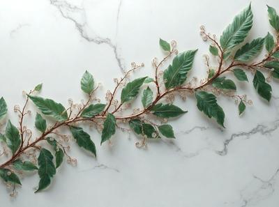The primary subject of the image is a branch with leaves, which is the main object, scene, or focus of the image. The setting is a white marble countertop, and the visual style is a photo. The colors and mood of the image are predominantly green, as the leaves are green, and the overall atmosphere is natural and serene.