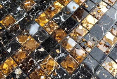 The primary subject of the image is a marble tile with a gold and black pattern. The setting is a black and gold marble tile floor. The visual style is a close-up of the tile, showcasing its intricate design. The colors and mood of the image are predominantly black and gold, giving it a luxurious and elegant appearance.