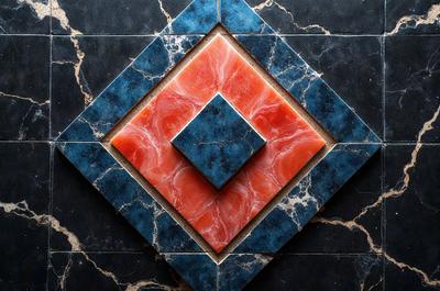 The primary subject of the image is a square tile with a red and blue pattern. The tile is part of a larger design, possibly a mosaic or a decorative wall. The setting is a room with a black and white marble floor, which adds a contrasting element to the overall design. The visual style of the image is a close-up of the tile, showcasing its intricate pattern and colors. The dominant colors in the image are red and blue, creating a vibrant and eye-catching atmosphere.