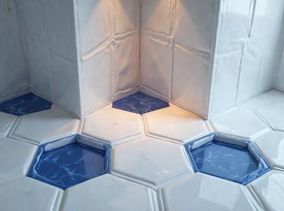The primary subject of the image is a white tile floor with blue water-like designs on it. The setting is a bathroom, as indicated by the presence of a white shower stall. The visual style is a combination of a photo and digital art, creating a unique and eye-catching design. The colors and mood of the image are predominantly white and blue, giving it a clean and calming atmosphere.