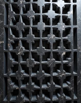 The primary subject of the image is a black and white patterned tile. The setting is a marble countertop, and the visual style is a close-up of the tile. The colors and mood of the image are predominantly black and white, giving it a classic and elegant appearance.