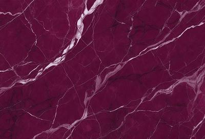 The primary subject of the image is a marbled wall with a purple hue. The setting is a room with a purple marbled wall as the main focus. The visual style is a close-up of the marbled wall, showcasing its intricate patterns. The colors and mood of the image are predominantly purple, creating a calm and elegant atmosphere.