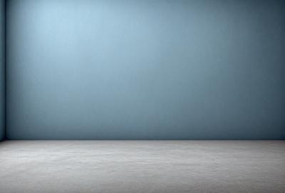 The primary subject of the image is a large, empty room with a blue wall. The setting is a room with a blue wall, and the visual style is a photo. The colors and mood of the image are predominantly blue, creating a calm and serene atmosphere.