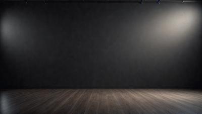 The primary subject of the image is a large, empty black stage. The setting is a darkened theater, with a black curtain covering the stage. The visual style is a photo, capturing the empty stage with a black background. The colors and mood of the image are dark and dramatic, emphasizing the emptiness of the stage.