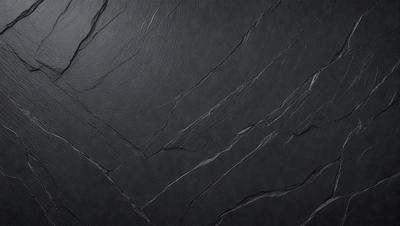 The primary subject of the image is a close-up of a black countertop with a leather-like texture. The setting is a kitchen or a similar environment, as the countertop is a part of a table. The visual style is a photo, capturing the details of the countertop and its texture. The colors and mood of the image are dark and moody, with the black countertop and leather-like texture creating a dramatic and sophisticated atmosphere.