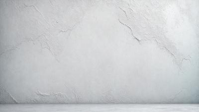 The primary subject of the image is a white wall with a rough texture. The setting is a room with a concrete wall, and the visual style is a photo. The dominant colors are white and gray, creating a clean and minimalist atmosphere.