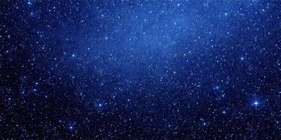 The primary subject of the image is the night sky filled with stars. The setting is a dark, star-filled sky, and the visual style is a photo of the night sky. The colors and mood of the image are predominantly dark and serene, with the stars providing a sense of wonder and tranquility.