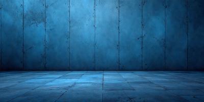 The primary subject of the image is a blue wall with a few dents. The setting is a room with a blue floor. The visual style is a photo, and the dominant colors are blue and grey. The overall atmosphere is calm and serene.