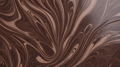 The primary subject of the image is a close-up of a wooden surface with a swirling pattern. The setting is a wooden table, and the visual style appears to be a photo of the wooden surface. The colors and mood of the image are predominantly brown, giving it a warm and natural atmosphere.