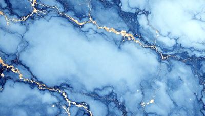 The primary subject of the image is a blue marble wall with gold streaks. The setting is a room with a blue marble wall as the main focus. The visual style is a photo of the marble wall, showcasing its unique texture and color. The dominant colors are blue and gold, creating a serene and elegant atmosphere.