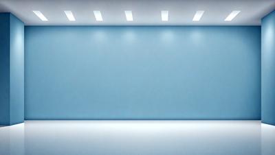 The primary subject of the image is a large, empty room with a blue wall. The setting is a white room with a blue wall, and the visual style is a photo. The colors and mood of the image are predominantly blue, creating a calm and serene atmosphere.