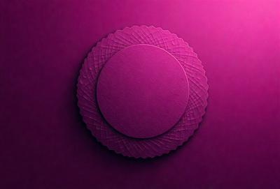 The primary subject of the image is a purple cake with a round shape. The cake is placed on a purple surface, which could be a table or a wall. The visual style of the image is a close-up of the cake, showcasing its details and texture. The colors and mood of the image are predominantly purple, creating a calm and elegant atmosphere.
