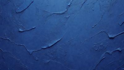 The primary subject of the image is a blue wall with a pattern of dripping paint. The setting is a room with a blue background, and the visual style appears to be a photo of the wall. The colors and mood of the image are predominantly blue, creating a calm and serene atmosphere.