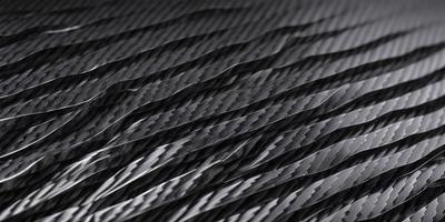 The primary subject of the image is a close-up of a black and white pattern, which appears to be a wavy or rippled surface. The setting is a black background, which contrasts with the pattern. The visual style is a close-up of the pattern, showcasing its intricate details. The colors and mood of the image are predominantly black and white, giving it a classic and timeless feel.
