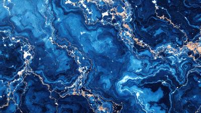 The primary subject of the image is a blue and white marbled stone. The setting is a blue and white marbled stone surface, which is the main object, scene, or focus of the image. The visual style is a photo, and the colors and mood are predominantly blue and white, creating a calm and serene atmosphere.
