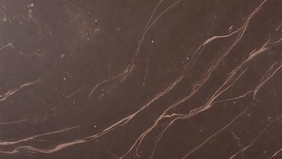 The primary subject of the image is a marble-like surface with a brown color. The setting is a dark room, and the visual style appears to be a close-up of the marble surface. The colors and mood of the image are dark and moody, creating a sense of depth and intrigue.