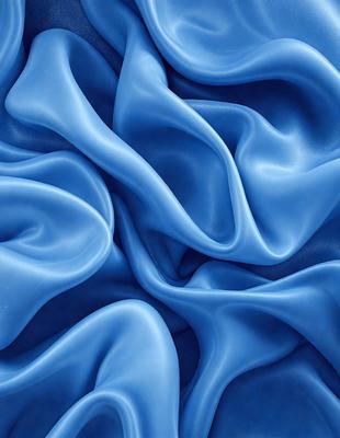 The primary subject of the image is a blue fabric, possibly a piece of clothing or a curtain. The setting is a close-up of the fabric, showcasing its texture and pattern. The visual style is a detailed, up-close view of the blue material. The colors and mood of the image are predominantly blue, creating a calm and serene atmosphere.
