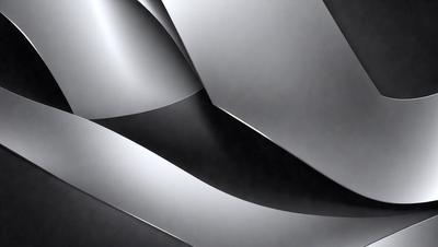 The primary subject of the image is a silver metal sculpture. The setting is a black background, which contrasts with the shiny metal surface. The visual style is a close-up of the sculpture, showcasing its intricate design. The colors and mood of the image are predominantly black and silver, creating a sleek and modern atmosphere.