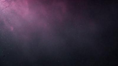 The primary subject of the image is the night sky, which is filled with stars. The setting is a dark, cloudy night, with the sky serving as the background. The visual style of the image is a photo, capturing the beauty of the night sky. The colors and mood of the image are predominantly dark and moody, with the stars providing a contrasting and serene atmosphere.